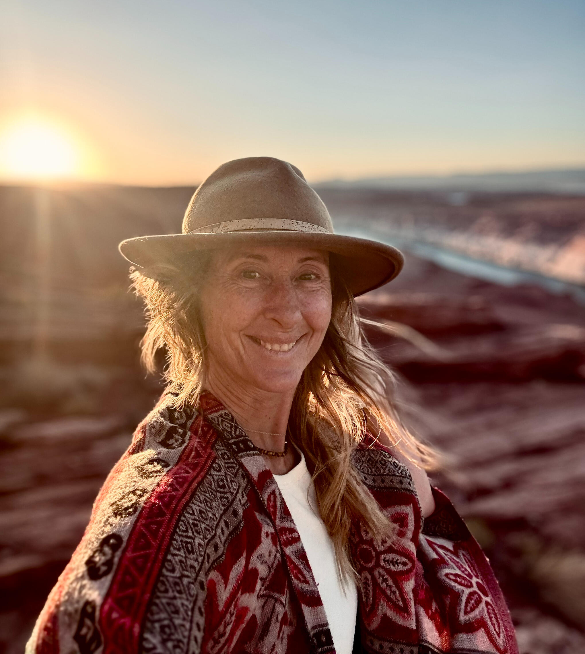 Woman smiling in warm evening light in the Arizona desert